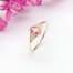 La bague BÉATRICE sertie d'une tourmaline rose et de saphirs blancs en or jaune 18 carats Fairmined, pièce unique taille 53