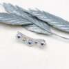 La boucle d'oreille LENA grimpante en argent et saphirs bleus